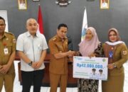 Pemkot Kotamobagu Serahkan Santunan Jaminan Kematian bagi Pekerja Rentan: Bukti Nyata Perlindungan Sosial